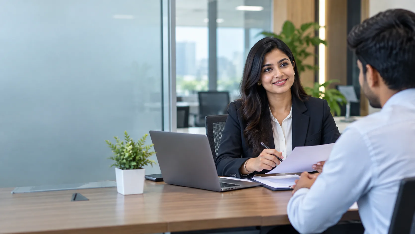 Indian staffing consultant and business manager discussing workforce requirements